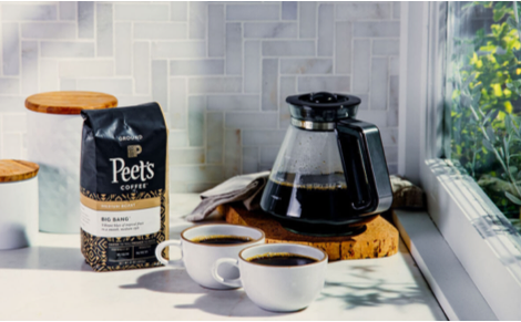 A bag of Peet’s Big Bang coffee, along with cups of hot brewed coffee